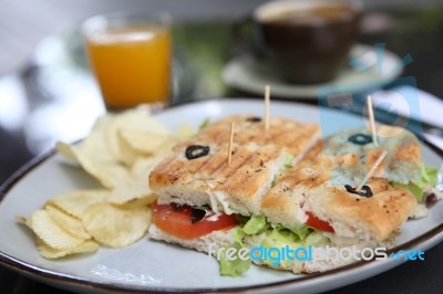 Sandwich With Orange And Coffee Stock Photo