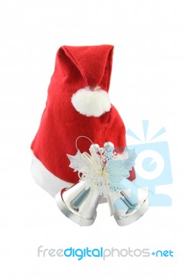 Santa Claus Hat And Christmas Bell On White Background Stock Photo