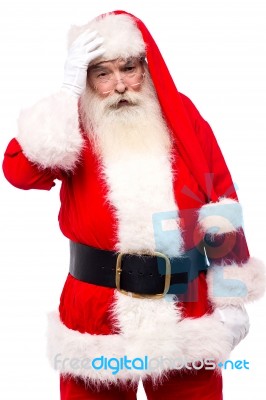 Santa Claus Suffering From Headache Stock Photo