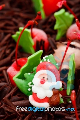 Santa Doll On Top Of Iced Cake Stock Photo