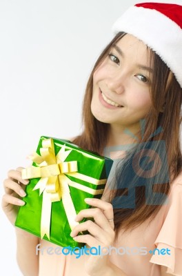 Santa Girl Holding Christmas Gift Stock Photo
