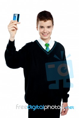 School Boy Holding Credit Card Stock Photo