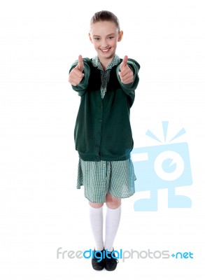 Schoolgirl Showing Double Thumb Up Stock Photo