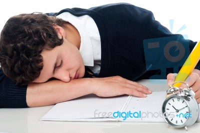 Schoolgirl Sleeping On Desk Stock Photo