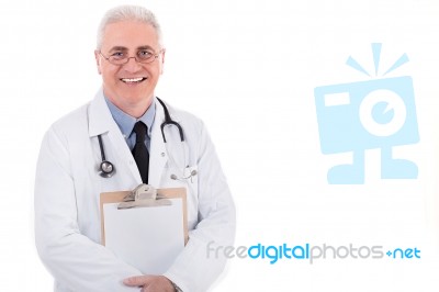 Senior Doctor Holding Clipboard Stock Photo