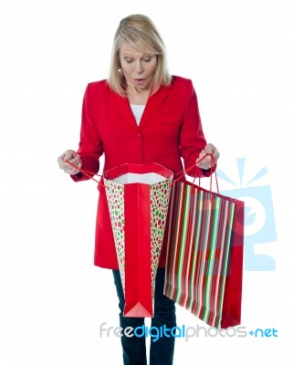 Senior Lady Holding Shopping Bag Stock Photo