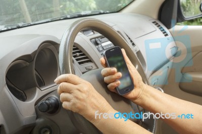 Senior Woman Driving Car Stock Photo