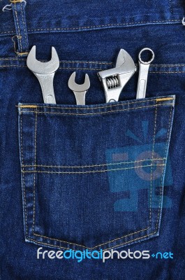 Several Tools On A Denim Workers Pocket Stock Photo