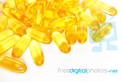 Shiny Yellow Fish Oil Capsule Pills Closeup Stock Photo