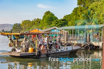 Ship Passenger And Motorbikes Across  Khwae Noi River At Kanchanaburi Thailand .december 2, 2018 Stock Photo