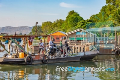 Ship Passenger And Motorbikes Across  Khwae Noi River At Kanchanaburi Thailand .december 2, 2018 Stock Photo