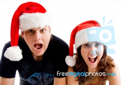 Shouting Couple Wearing Santa Hat Stock Photo