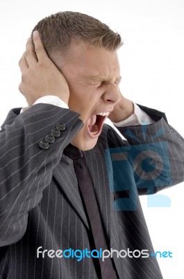 Side Pose Of Shouting Businessman Stock Photo