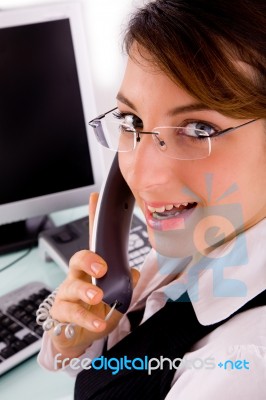 Side Pose Of Smiling Professional Looking At Camera Stock Photo