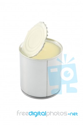 Side View Of Opened Sweet Milk Tin Can On White Background Stock Photo