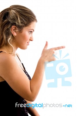 Side View Of Pointing Female Stock Photo
