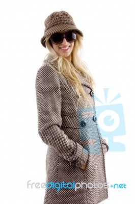 Side View Of Smiling Female In Overcoat Stock Photo