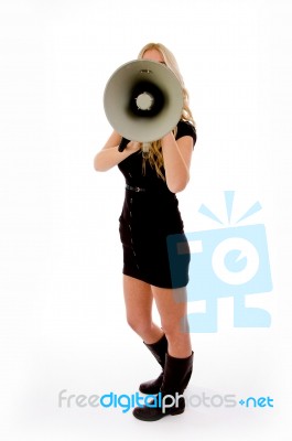 Side View Of Young Female Holding Loud Speaker Stock Photo