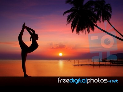 Silhouette Girl Doing Yoga Stock Photo