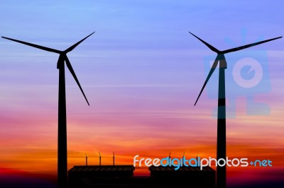 Silhouette Wind Turbine Generator With Factory Emissions Of Carb… Stock Photo