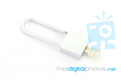 Silver Padlock With Key Close On White Background Stock Photo
