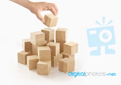 Single Hand Playing Wooden Box On Isolated Background Stock Photo