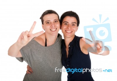 Sisters Showing Victory Sign Stock Photo
