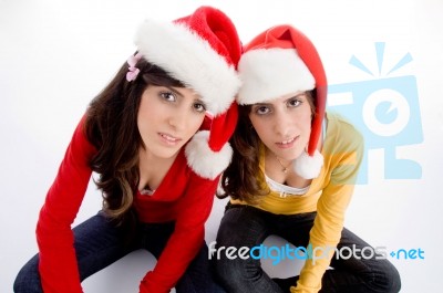 Sitting Females With Christmas Hat Stock Photo