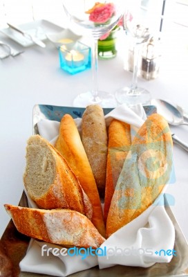 Sliced Baguette With Kitchenware Stock Photo