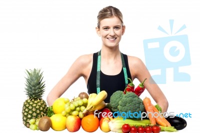 Slim Fit Girl With Fresh Fruits And Vegetables Stock Photo
