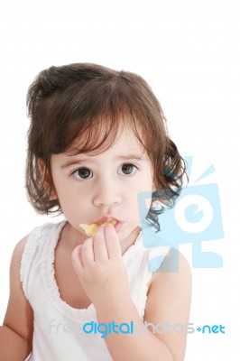 Small Child Eating Crisps Stock Photo