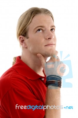Smart Young Man Thinking And Looking Sideways Stock Photo