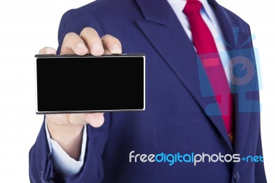 Smartphone On Businessman Hand Stock Photo