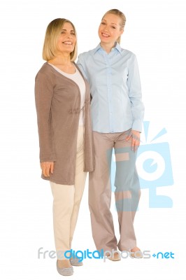 Smiley Grandmother And Young Mother Standing On White Background… Stock Photo