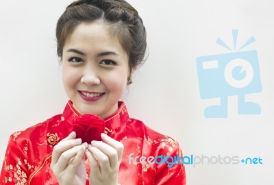 Smiling Beautiful Chinese Woman Holding The Rose Stock Photo