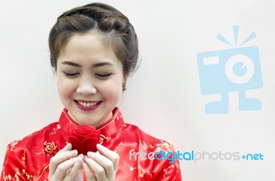 Smiling Beautiful Chinese Woman Staring At The Rose Stock Photo