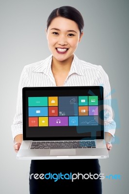 Smiling Beautiful Woman Holding Laptop Stock Photo