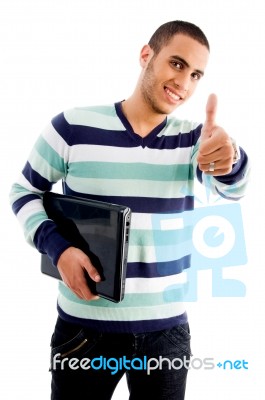 Smiling Boy With Laptop And Thumbs Up Stock Photo