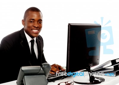 smiling businessman using computer stock photo royalty free image