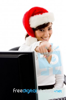 Smiling Christmas Woman Pointing Stock Photo