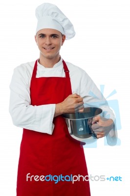 Smiling Confident Chef Holding Vessel Stock Photo