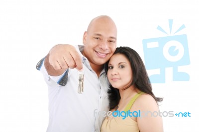 Smiling Couple Holding Keys Stock Photo