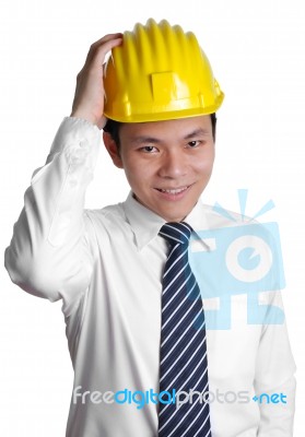 Smiling Engineer Put Hand On Helmet Stock Photo