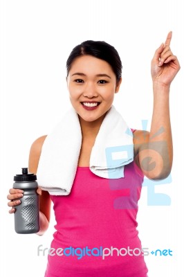 Smiling Fitness Woman Holding Sipper Bottle Stock Photo