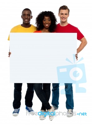 Smiling Friends Holding blank board Stock Photo
