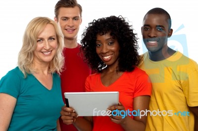 Smiling Friends Holding Tablet Pc Stock Photo