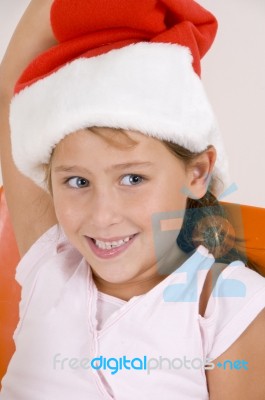 Smiling Girl Wearing Christmas Hat Stock Photo