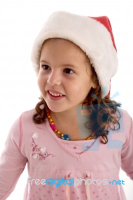 Smiling Girl Wearing Santa Hat Stock Photo