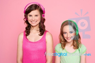 Smiling Girls Posing With Headphone Stock Photo