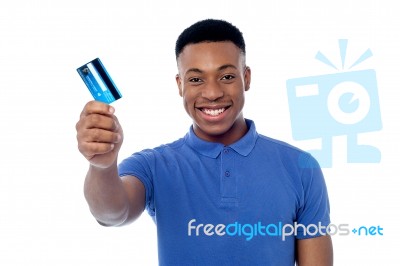smiling guy holding credit